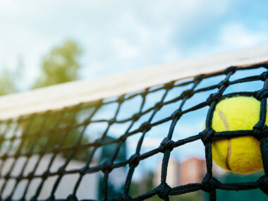Close up photo tennis ball hitting net sport concept Close up photo tennis ball hitting net sport concept